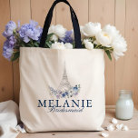 Paris Eiffel Tower Watercolor Floral White Wedding Tote Bag<br><div class="desc">Our Paris Whisper wedding rsvp card design evokes a romanic and lovely french elegance. Beautiful watercolor floral combination with whispers of french blue and soft lavender shades capture a Parisian elegance. Romantic typographic pairing of serifs and elegant script details further enhances the romanic style. A subtle hand-drawn Eiffel Tower imagery...</div>