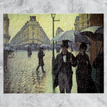 Paris Street Rainy Day by Gustave Caillebotte Jigsaw Puzzle<br><div class="desc">Paris Street, Rainy Day (aka Paris: A Rainy Day) (1877) by Gustave Caillebotte is a vintage impressionism fine art urban cityscape painting. A cobblestone street intersection near the Gare Saint-Lazare, a railroad train station in north Paris, France. People are walking in the rain holding umbrellas in the city. About the...</div>