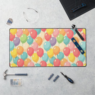 Party balloons in different colors desk mat