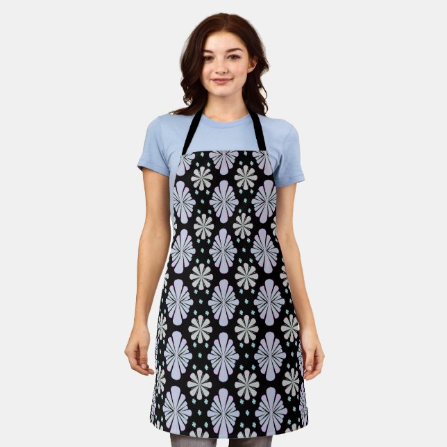 Pastel floral shapes on a black background apron (Worn)