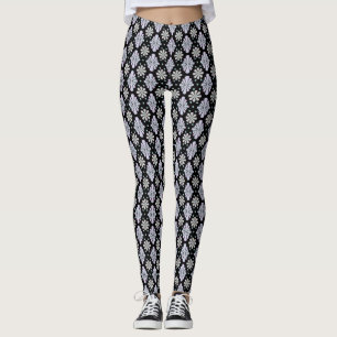 Pastel floral shapes on a black background leggings