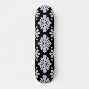 Pastel floral shapes on a black background skateboard