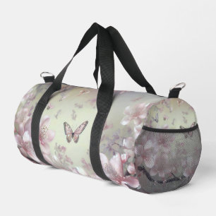 Pastel pink floral and butterfly pattern duffle bag