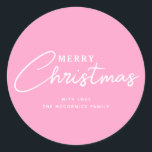 Pastel Pink Merry Christmas Script Name Classic Round Sticker<br><div class="desc">Pastel Pink Merry Christmas Script Name Classic Round Stickers are perfect for pastel holiday theme. Each is designed with text "Merry Christmas" in white letters on light pink. The font is hand script lettering mixed with simple easy to read letters. Personalised with family signature name or "from" name on the...</div>