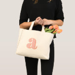 Pastel Pink Orange Monogrammed Retro Lettering Mini Tote Bag<br><div class="desc">Add a fun retro flair to your look with this mini tote bag, featuring a monogram in pastel pink and orange retro lettering! Perfect for everyday use or as a stylish accessory for weekend getaways, this unique design blends nostalgic vibes with modern convenience. The playful colour palette is ideal for...</div>