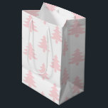 Pastel Pink Trees Pattern Christmas Medium Gift Bag<br><div class="desc">Match your pink Christmas theme with this Pastel Pink Trees Pattern Christmas Medium Gift Bag. This is a modern minimalist design with white background and small light pink silhouette trees. Easy design to match a pastel Christmas theme for the holidays. You can customise and change to any colour or shade!...</div>
