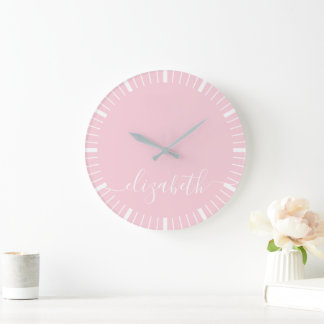pastel pink with white script signature - minimal large clock