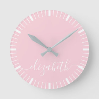 pastel pink with white script signature - minimal round clock