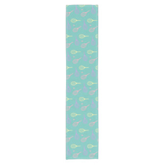 Pastel Tennis Rackets with Tennis Ball on Green Short Table Runner