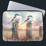 Pastel Watercolor Birds Fencepost Sunset Laptop Sleeve<br><div class="desc">Soft watercolor brushwork captures two fluffy songbirds resting on weathered fence posts as a glowing sunset spreads across a dreamy countryside sky. Gentle washes of peach, blush pink, pale blue, and warm gold blend into a tranquil horizon, creating a calm pastoral atmosphere. The birds appear round and feathery, their delicate...</div>