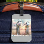 Pastel Watercolor Birds Fencepost Sunset Luggage Tag<br><div class="desc">Soft watercolor brushwork captures two fluffy songbirds resting on weathered fence posts as a glowing sunset spreads across a dreamy countryside sky. Gentle washes of peach, blush pink, pale blue, and warm gold blend into a tranquil horizon, creating a calm pastoral atmosphere. The birds appear round and feathery, their delicate...</div>