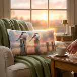 Pastel Watercolor Birds Fencepost Sunset Lumbar Cushion<br><div class="desc">Soft watercolor brushwork captures two fluffy songbirds resting on weathered fence posts as a glowing sunset spreads across a dreamy countryside sky. Gentle washes of peach, blush pink, pale blue, and warm gold blend into a tranquil horizon, creating a calm pastoral atmosphere. The birds appear round and feathery, their delicate...</div>