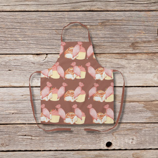 Pastry bags, cinnamon buns, and cupcakes brown apron