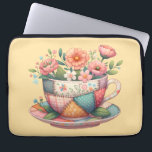 Patchwork Teacup with Whimsical Flowers Laptop Sleeve<br><div class="desc">A charming fusion of cozy cottagecore and nostalgic patchwork, this design features a teacup bursting with whimsical florals in soft, pastel hues. Each panel of the teacup is adorned with vintage-inspired fabric patterns—plaids, florals, and polka dots—stitched together with visible seams for a handmade, quilt-like look. The surrounding flowers bloom in...</div>