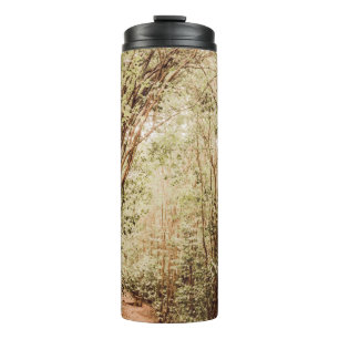 PATHWAY SURROUNDED WITH TALL AND GREEN TREES THERMAL TUMBLER
