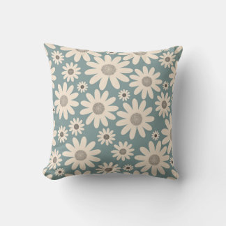 Pattern of chamomile flowers on a soft green cushion