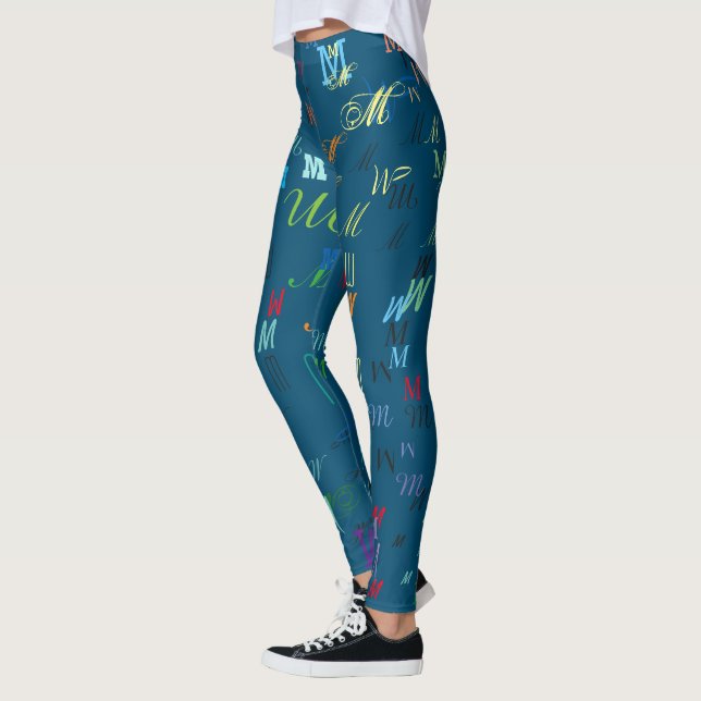 Pattern of colourful initials personalised on blue leggings (Left)