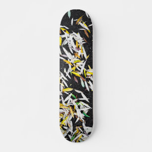 Pattern of the falling leaves on black skateboard