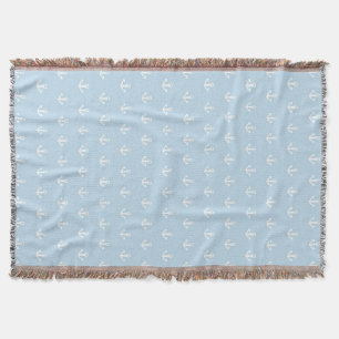 Pattern with white anchors on blue throw blanket