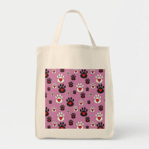 Paw prints with red hearts on pink  tote bag