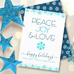 Peace Joy Love Turquoise Snowflake Typography Bold Holiday Card<br><div class="desc">“Peace, joy & love.” A fun, playful, snowflake illustration and modern typography on a white background help you usher in the holiday season. Additional faux turquoise foil snowflakes and confetti dots frame the card. A white snowflake pattern overlays dark blue on the back. Feel the warmth and joy of the...</div>