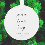 Peace Love and Hugs Minimal White Simple Christmas Ornament<br><div class="desc">Simple, stylish, minimalist holiday ornament with modern informal casual handwritten script typography quote "Peace Love & Hugs" in black with a clean simple white background. The name and year can be easily customised for a personal touch. A elegant, minimalist and contemporary christmas design to stand out from the crowd this...</div>