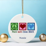 Peace Love Cross Stitch Cute Personalised Ceramic Tree Decoration<br><div class="desc">Cute cross stitching ornament gift for someone who loves to create things. This custom Peace Love Cross Stitch gift features a peace sign,  heart,  and a pretty cross-stitch pattern heart.</div>