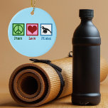 Peace Love Pilates Ceramic Tree Decoration<br><div class="desc">Peace Love Pilates. A cute pilates instructor gift featuring a peace sign,  heart,  and woman stretching over an exercise ball.</div>