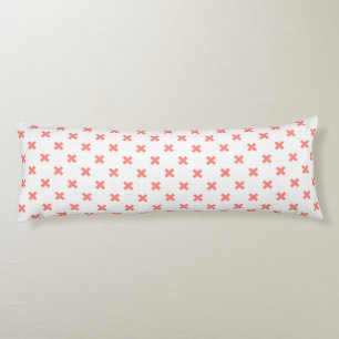 Peach cross stitches on white body cushion