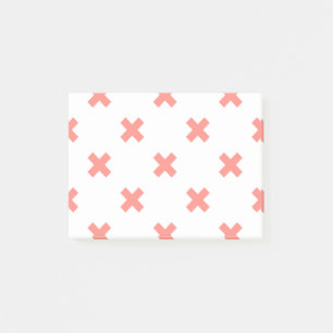 Peach cross stitches on white post-it notes