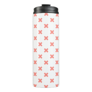 Peach cross stitches on white thermal tumbler