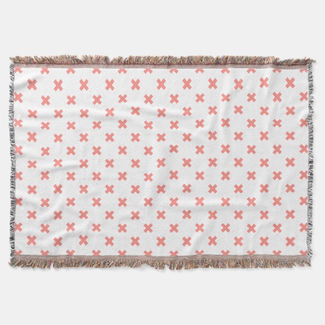 Peach cross stitches on white throw blanket (Front)