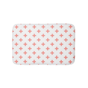 Peach polka crosses on white bath mat