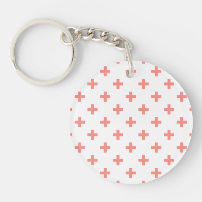 Peach polka crosses on white key ring (Front)