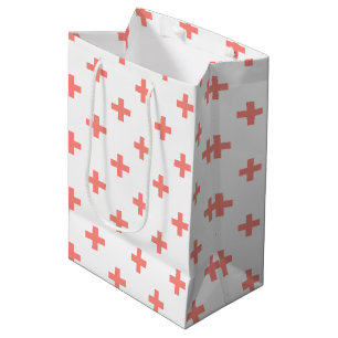 Peach polka crosses on white medium gift bag