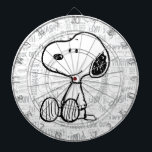 PEANUTS | Snoopy on Black White Comics<br><div class="desc">This Peanuts artwork features Snoopy sitting on background of black and white Charles M. Schulz comic strips.</div>