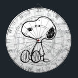 PEANUTS | Snoopy on Black White Comics<br><div class="desc">This Peanuts artwork features Snoopy sitting on background of black and white Charles M. Schulz comic strips.</div>