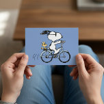 Peanuts | Snoopy & Woodstock Bicycle Postcard<br><div class="desc">Celebrate with a playful Peanuts twist using the Peanuts Snoopy & Woodstock Bicycle Postcard! Featuring Snoopy and Woodstock riding a bicycle together, this cheerful postcard is perfect for sending fun greetings to friends and family. Let the Peanuts gang add extra charm to any occasion with this vibrant and lighthearted postcard....</div>