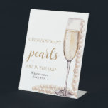 Pearls and Prosecco Guess How Many Pearls Game Pedestal Sign<br><div class="desc">The Pearls and Prosecco Guess How Many Pearls Game is a delightful addition to your bridal shower or wedding celebration. With elegant pearls and prosecco motifs, this game adds a touch of sophistication to the event. Guests can enjoy guessing the number of pearls in a jar or container, sparking friendly...</div>