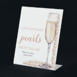 Pearls and Prosecco Guess How Many Pearls Game Pedestal Sign<br><div class="desc">The Pearls and Prosecco Guess How Many Pearls Game is a delightful addition to your bridal shower or wedding celebration. With elegant pearls and prosecco motifs, this game adds a touch of sophistication to the event. Guests can enjoy guessing the number of pearls in a jar or container, sparking friendly...</div>