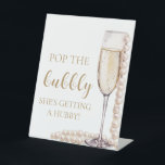 Pearls Prosecco Pop The Bubbly She's Getting Hubby Pedestal Sign<br><div class="desc">"Pop the Bubbly, She's Getting a Hubby" is a fun and festive way to celebrate the bride-to-be's upcoming nuptials. With the elegant theme of pearls and prosecco, this activity adds a touch of sophistication to the bridal shower or bachelorette party. Guests can enjoy popping champagne or prosecco bottles to toast...</div>