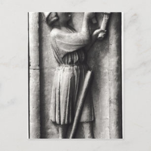 Peasant sharpening his scythe for the postcard