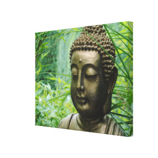 Peeaceful Buddha Statue in a Leafy Green Forest Canvas Print