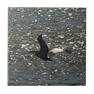 Pelican Flying Over Shimmering Lake Bafa Tile