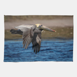 Pelican in flight tea towel