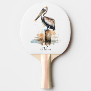 Pelican standing on a pole ping pong paddle