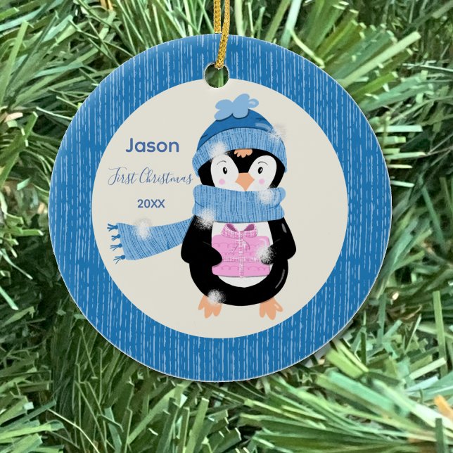 Penguin Holding Present Baby Ornament (Penguin with pink present first Christmas ornament .)