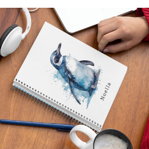 penguin in blue watercolor notebook