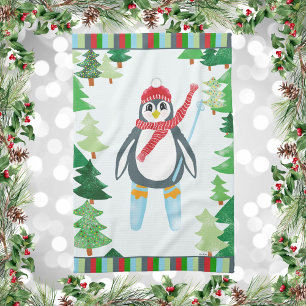 Penguin Skiing on a Mountain Of Christmas Trees Tea Towel