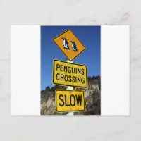 Penguins crossing yellow road sign